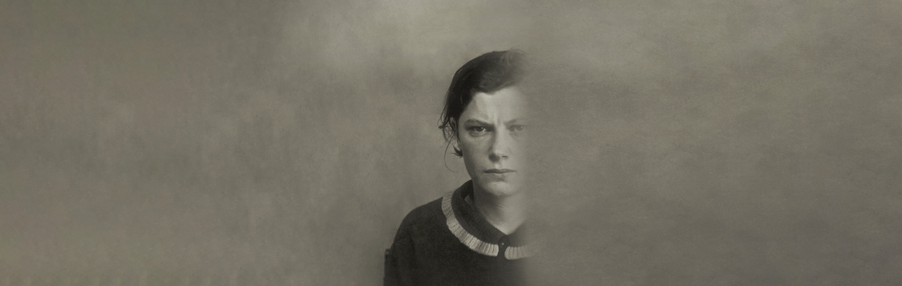 Baner ze zdjęciem Eugenii Bielin, twarz kobiety częściowo znika